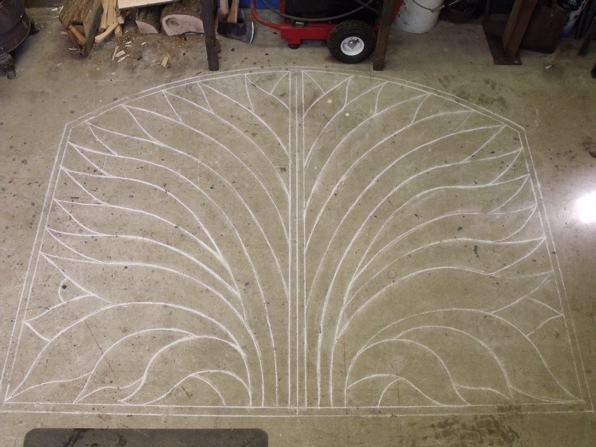 Chalk drawing on the workshop floor of a design for a metal Gate.
